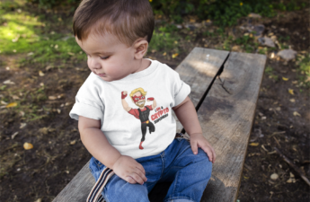mockup-of-a-baby-boy-looking-down-to-the-floor-while-wearing-a-tshirt-a16086